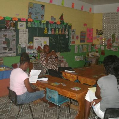 Adults sitting at desks in a classroom