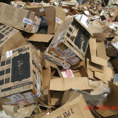 Torn cardboard boxes at the landfill