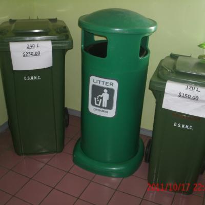 Three (3) litter bins next to each other