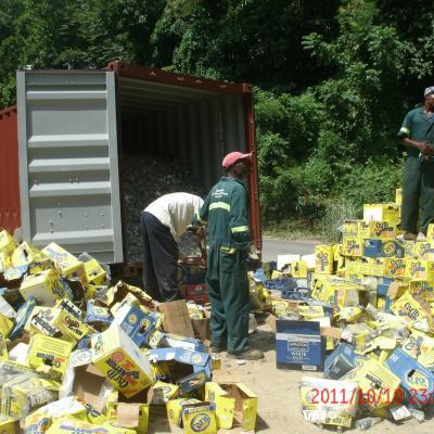 Sanitation workers sorting glass bottles