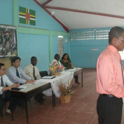 Petter St. Jean speaking to the patrons of the Goodwill Primary School Exhibition