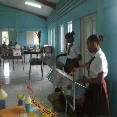 Students playing steel pan at the Goodwill Primary School Exhibition