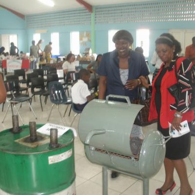 Patrons viewing recycled items made by the students