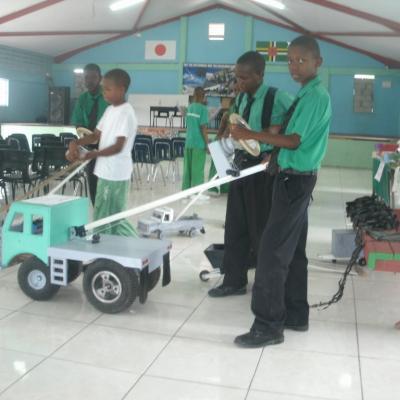 Students showing off their hand made toy trucks