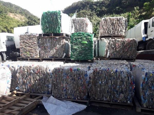 Bails of compressed plastic bottles ready for recycling