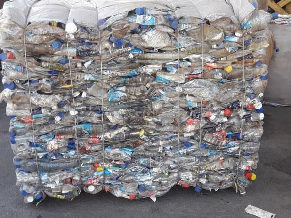 Bails of compressed plastic bottles ready for recycling