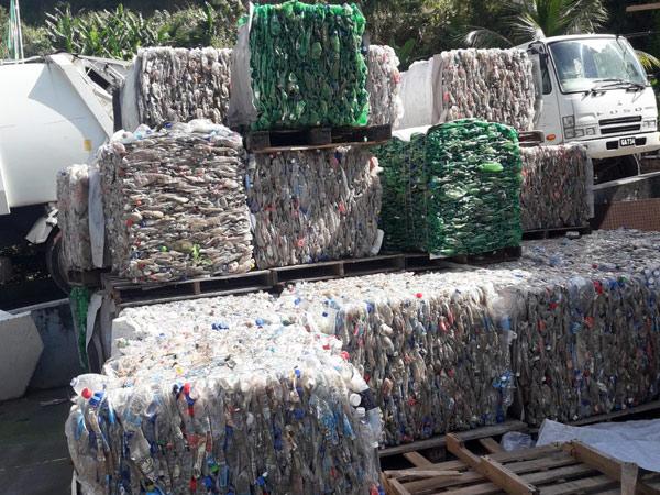 Bails of compressed plastic bottles ready for recycling
